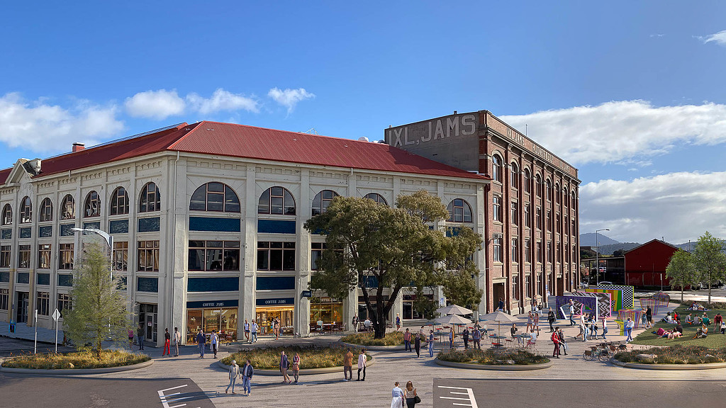 A large building with people walking around.